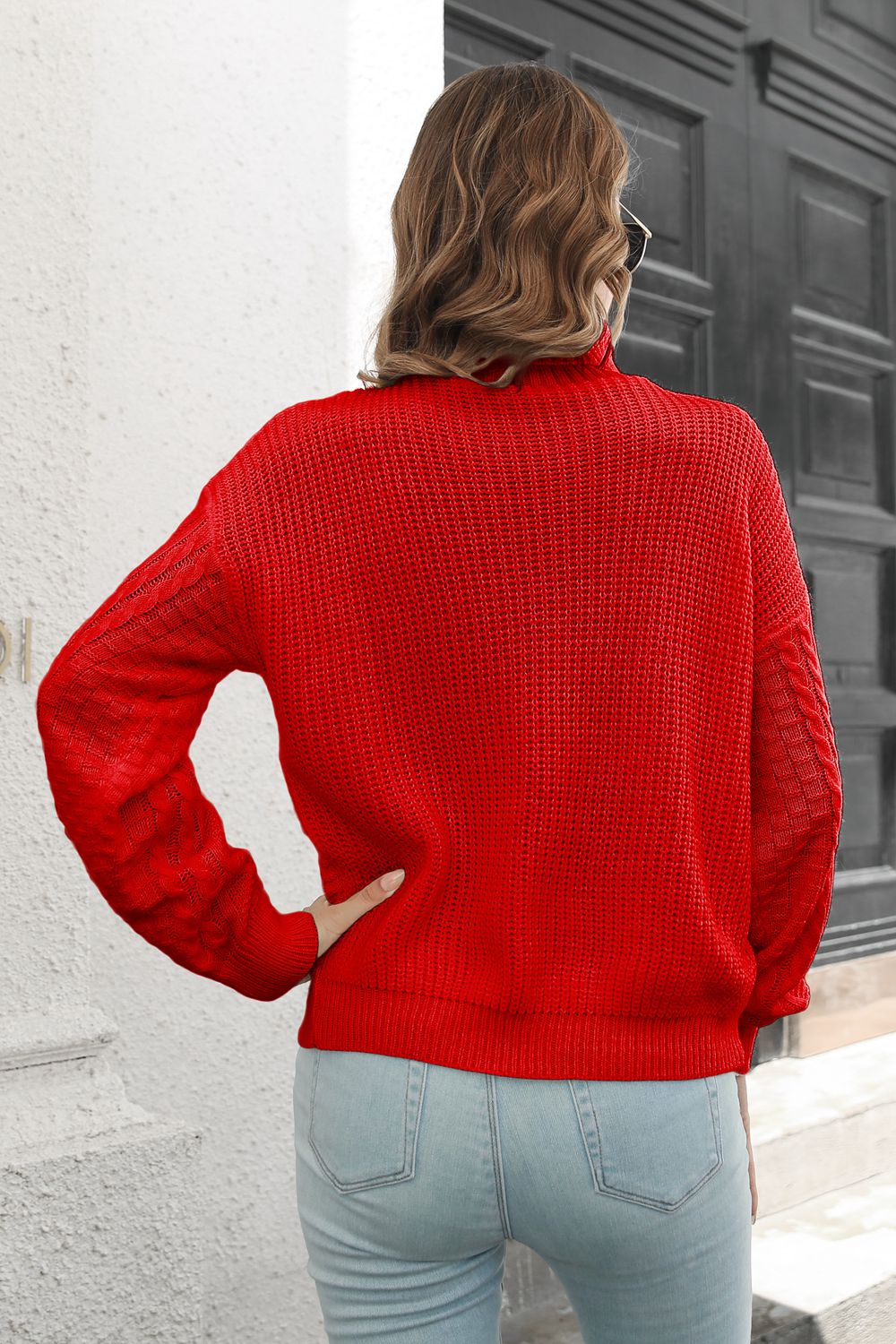 Back view of Cable-Knit Turtleneck Sweater showing full knitted design