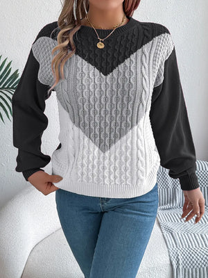 Front detail of long sleeve sweater showing fabric texture
