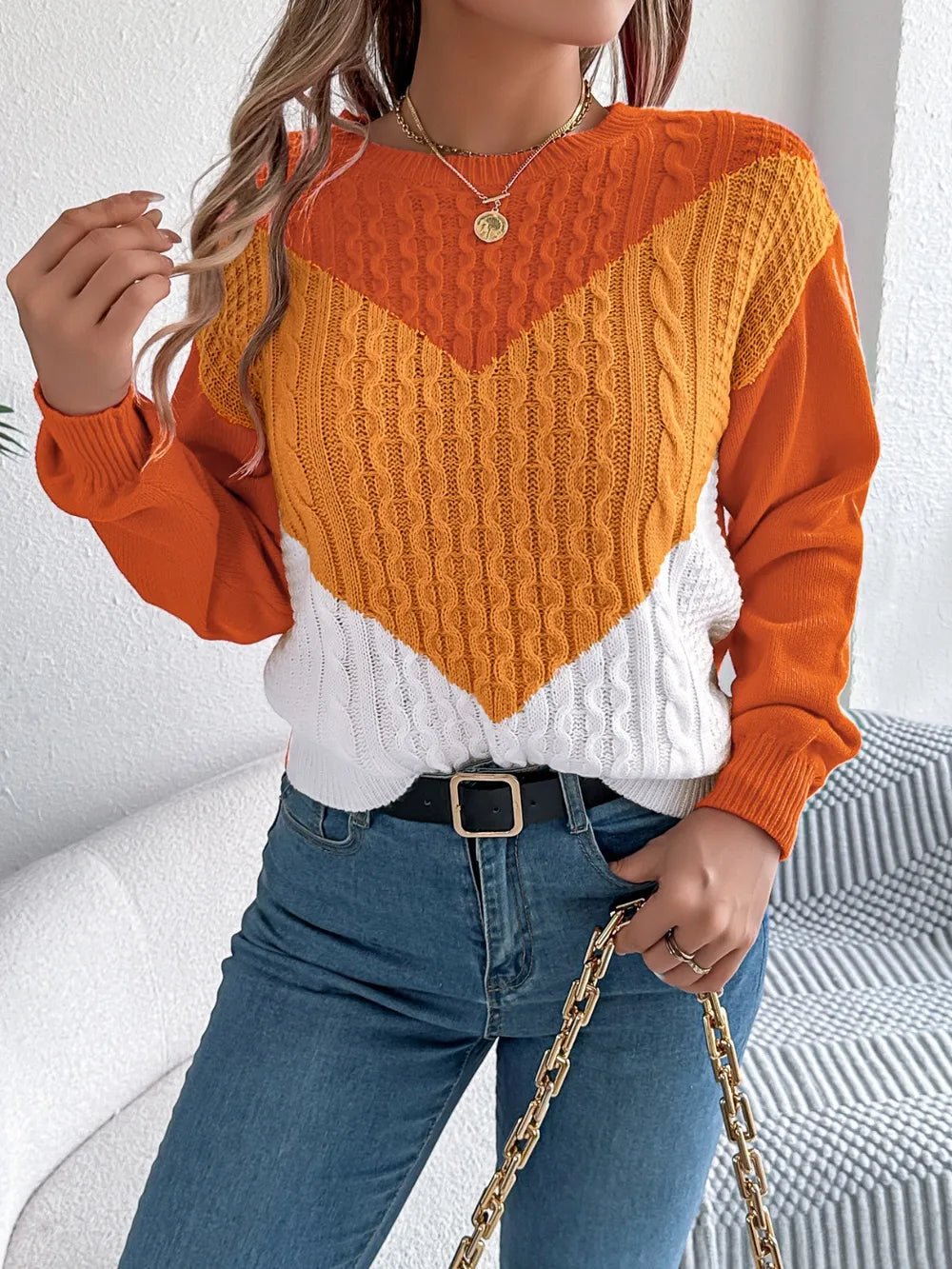 Sweater front view highlighting sleeve design