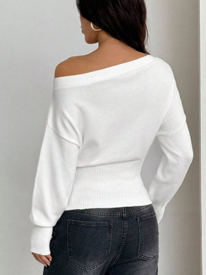 Back view of one shoulder cropped sweater