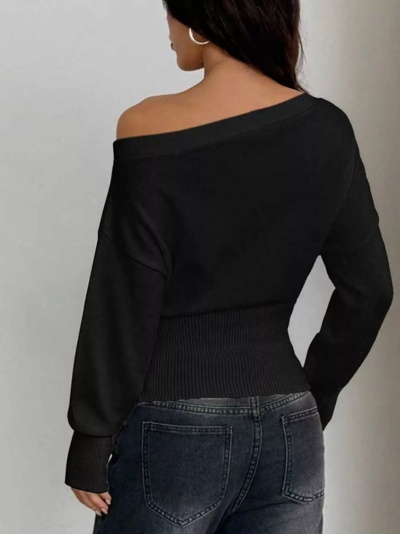 One shoulder cropped sweater styled with jeans