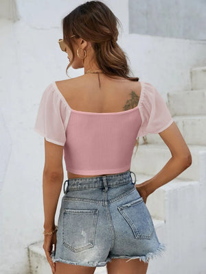 Back view of short sleeve crop top with drawstring waist