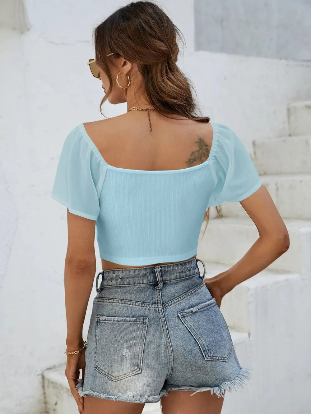 Back view of short sleeve crop top with drawstring waist
