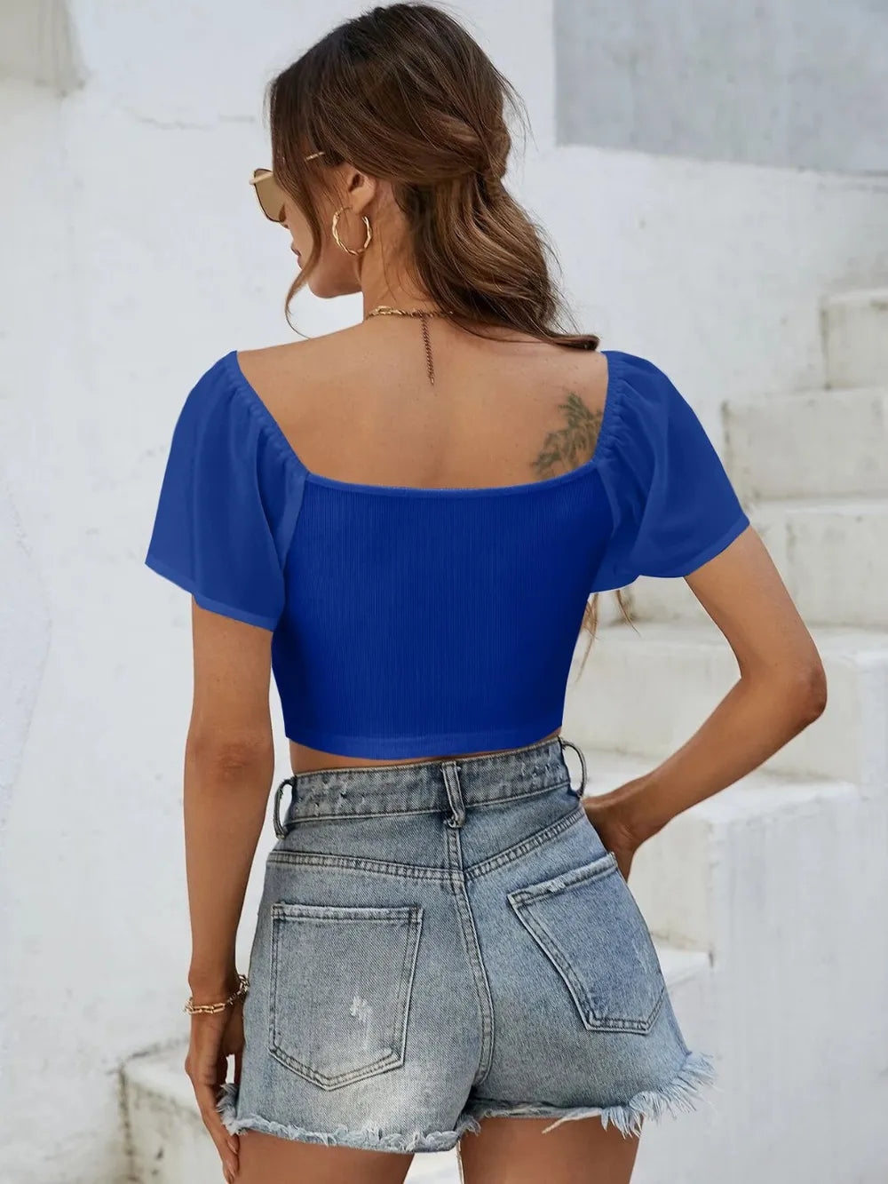 Back view of short sleeve crop top with drawstring waist