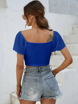 Back view of short sleeve crop top with drawstring waist