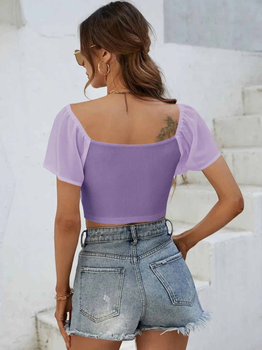 Back view of short sleeve crop top with drawstring waist