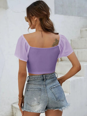 Back view of short sleeve crop top with drawstring waist
