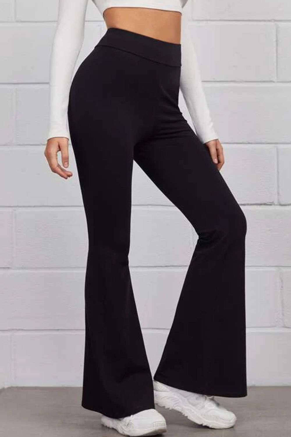 Pull on flared pants highlighting flared silhouette and side profile