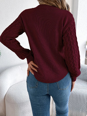 Back side of long sleeve asymmetric hem sweater