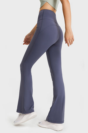 Back view showing clean seam lines, high-rise waistband, and flare from the rear