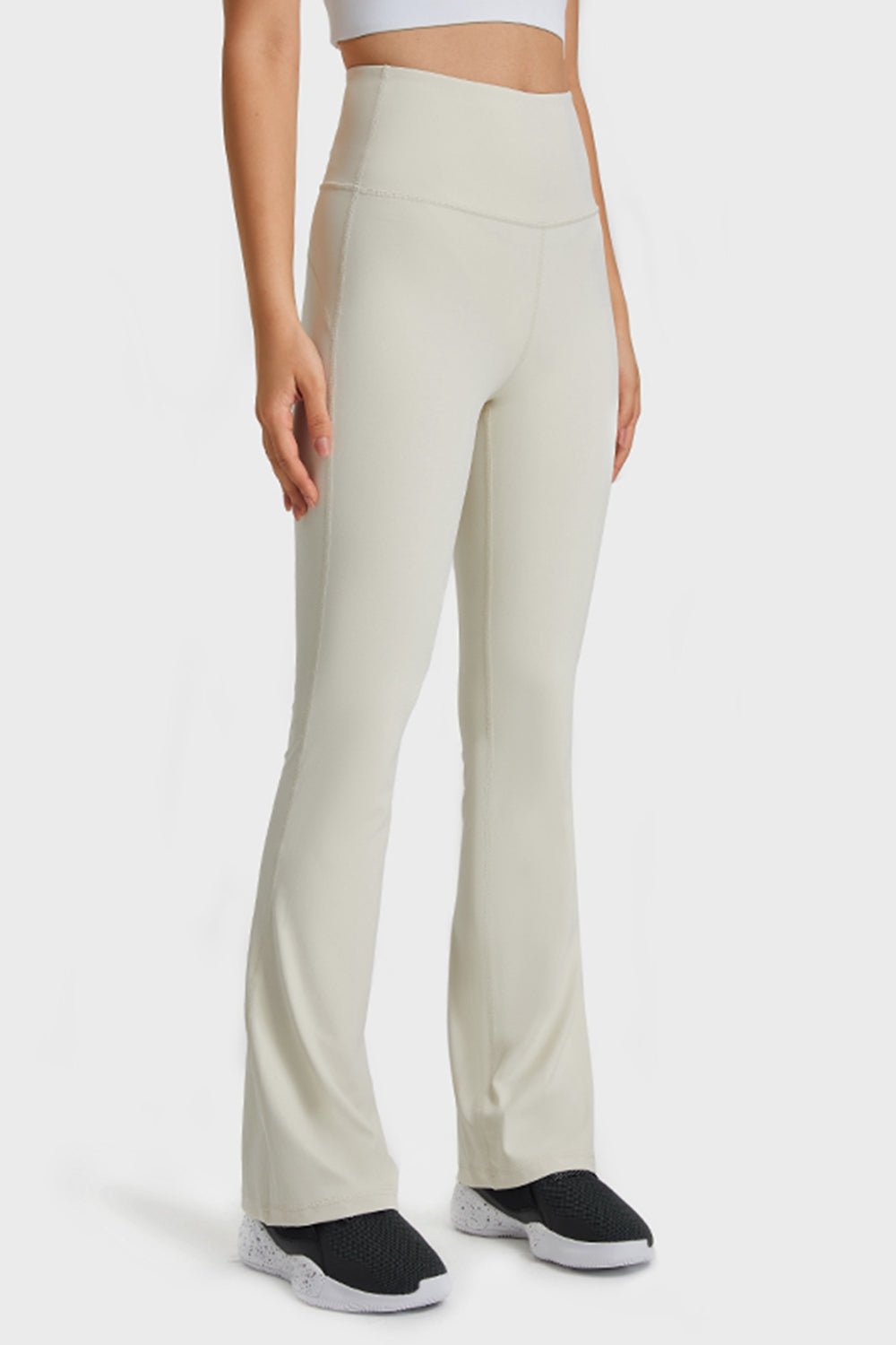 Front close-up displaying the texture of the elastic waistband and the flare leg line