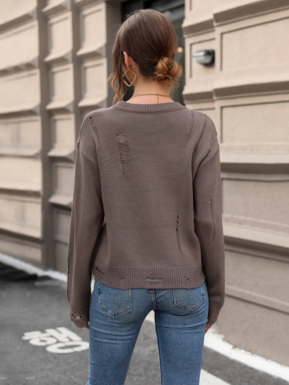 Back view of Perfee cutout round neck long sleeve sweater showing full knit design