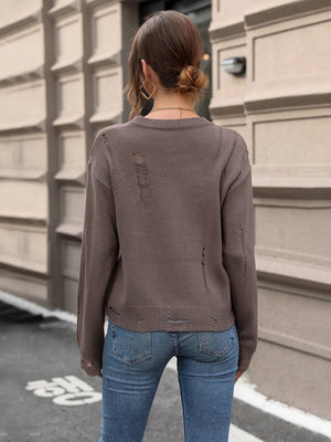 Back view of Perfee cutout round neck long sleeve sweater showing full knit design