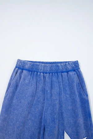 Display of acid wash star patched top and pants set