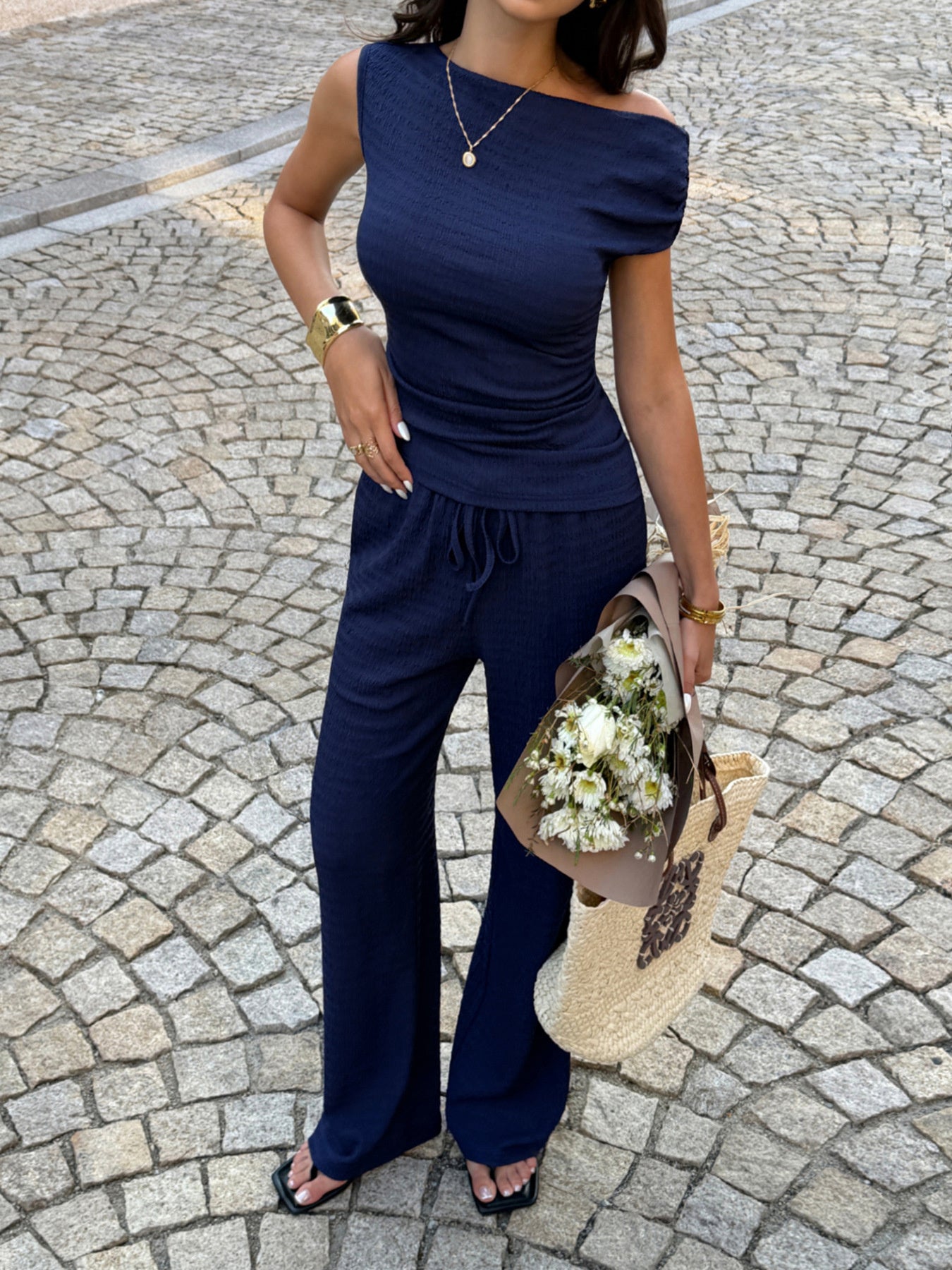 chic asymmetrical neckline top and pants set front detail view