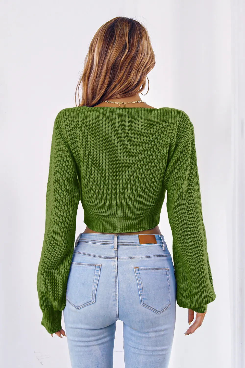 Rear look of cropped knit sweater with long sleeves