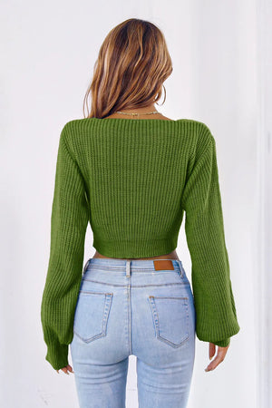 Rear look of cropped knit sweater with long sleeves