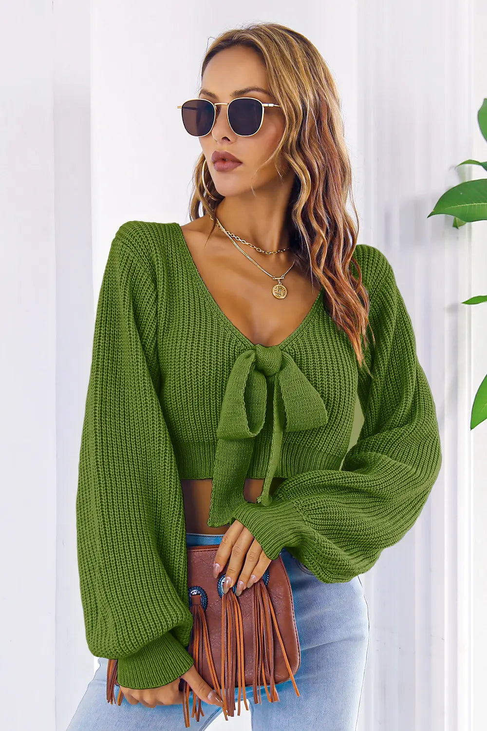 Front showcase of bow V-neck long sleeve sweater