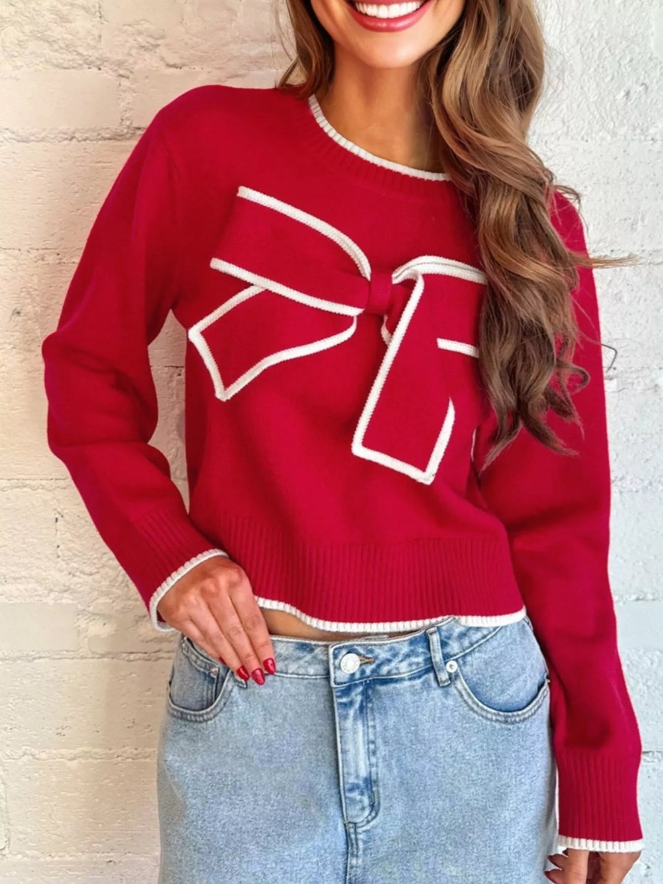 Cropped holiday sweater with bow accent front look