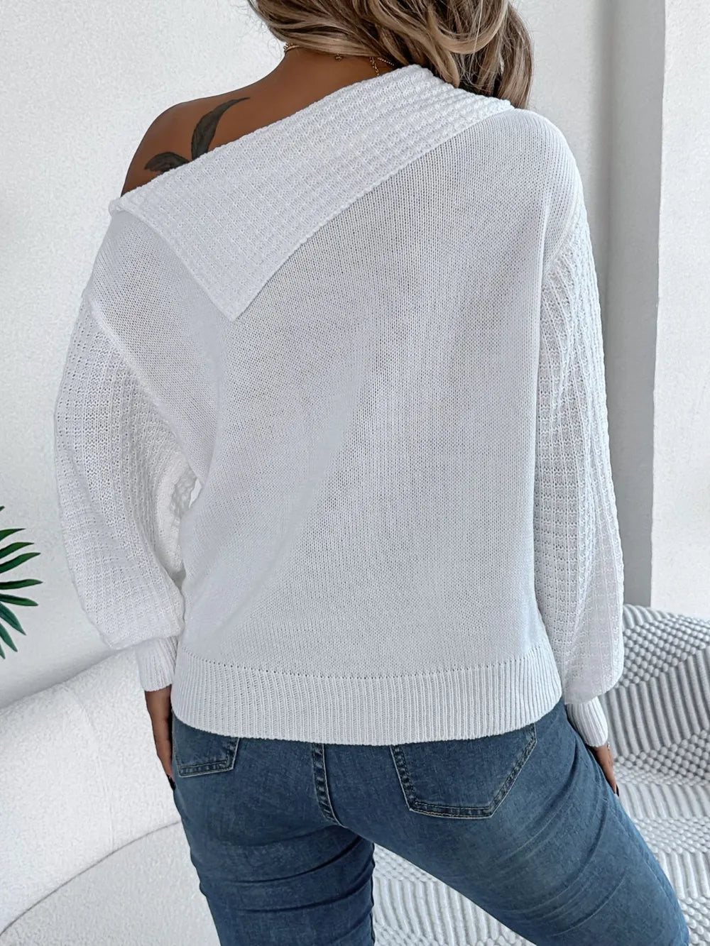 Back view of cable knit one shoulder sweater textured design