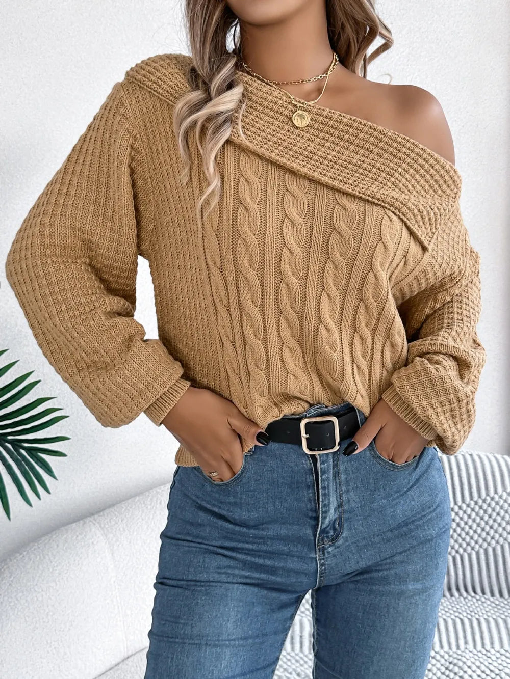 Front view of cable knit one shoulder long sleeve sweater stylish asymmetrical design