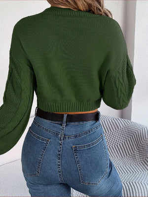 Rear angle view of cable-knit cropped sweater