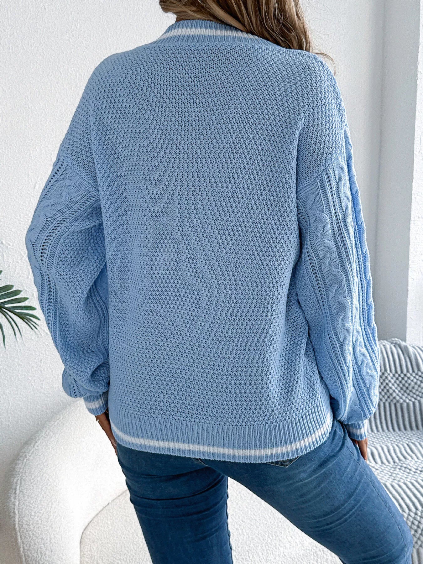 Cable knit V-neck sweater back view long sleeve cozy fit