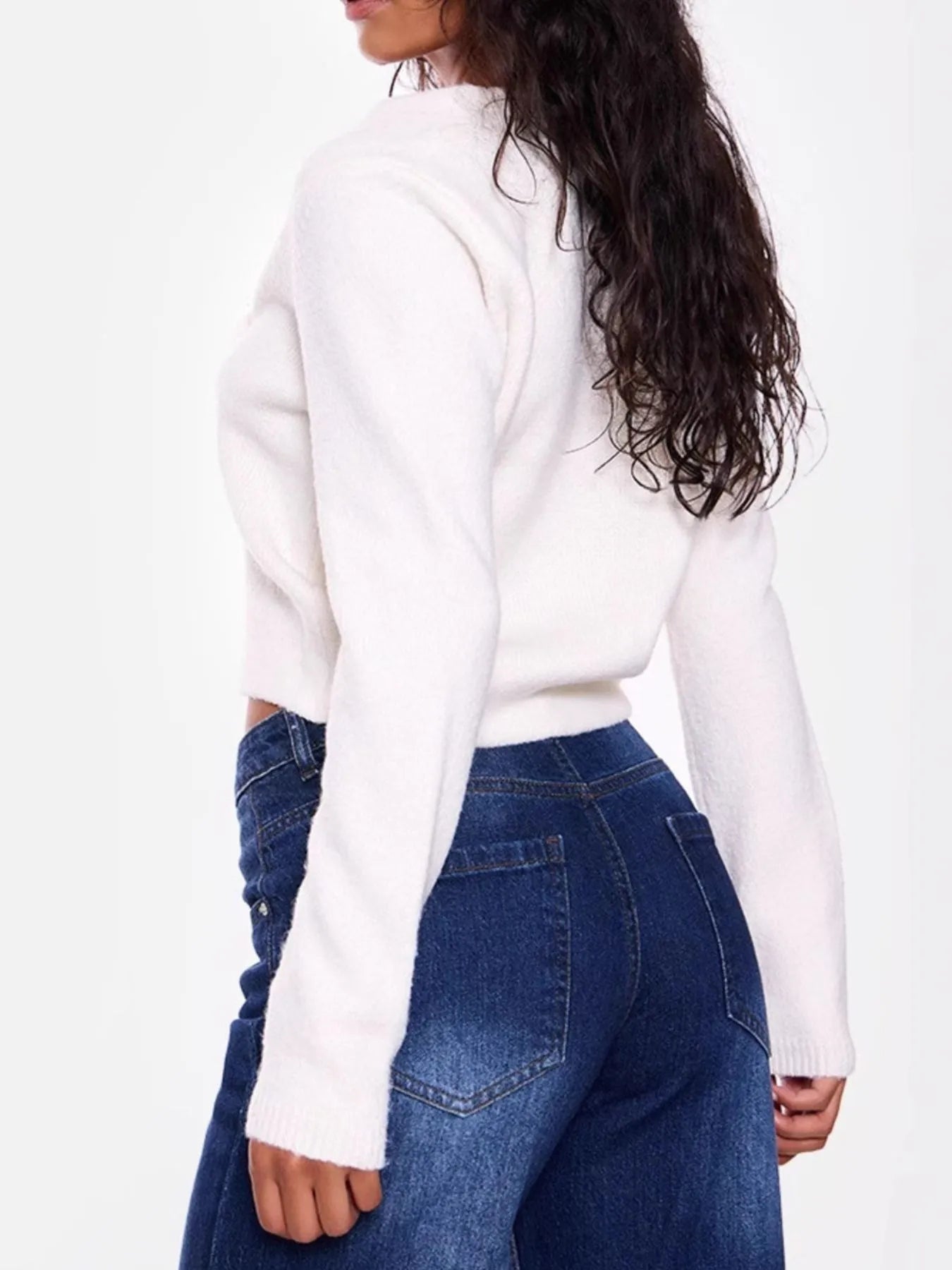 Back view of cropped V-neck button-up cardigan
