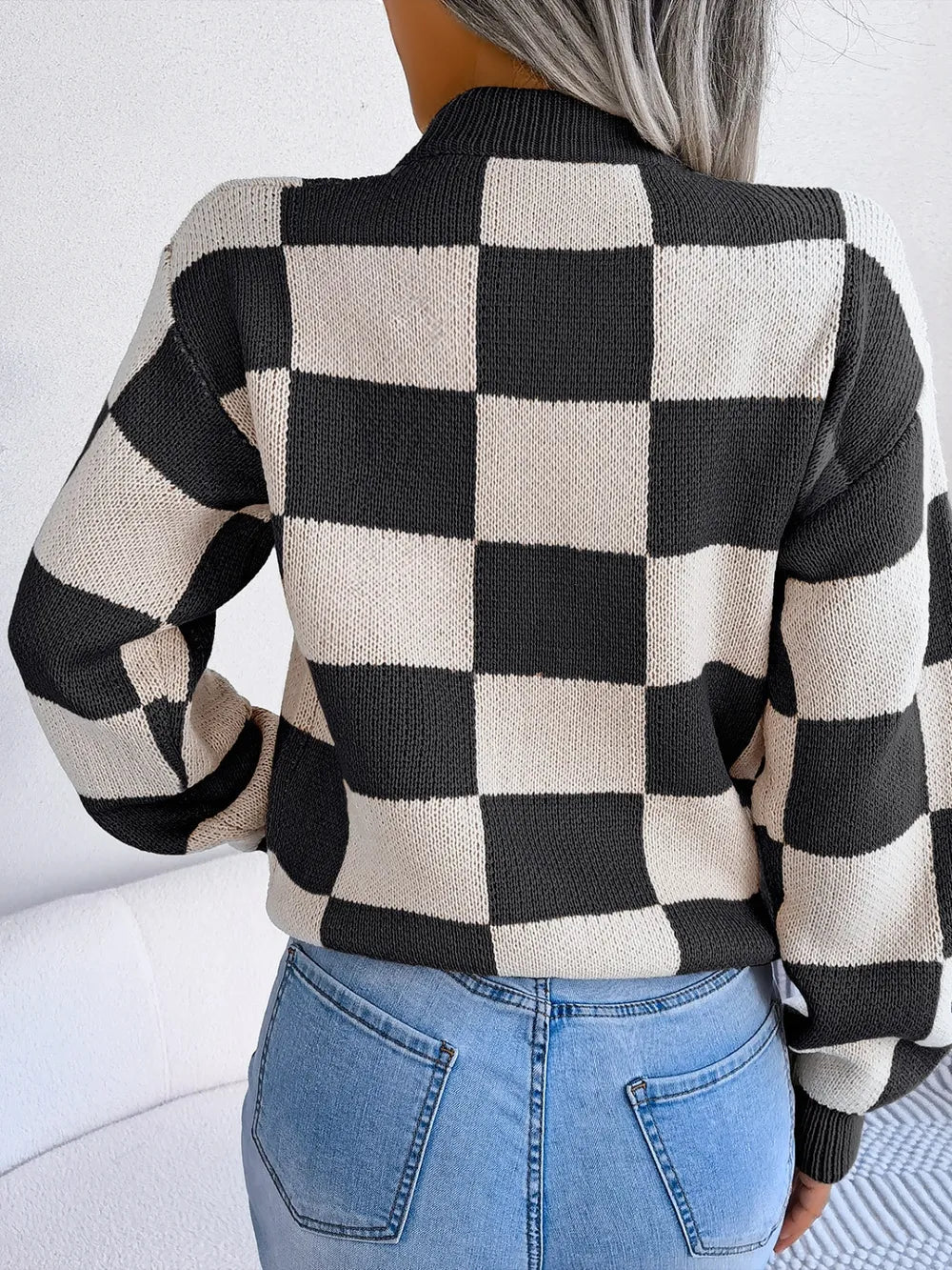 back view of checkered mock neck sweater