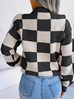 back view of checkered mock neck sweater