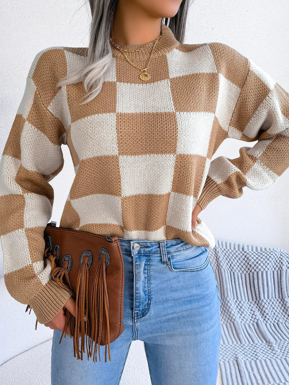 front detail of mock neck checkered sweater