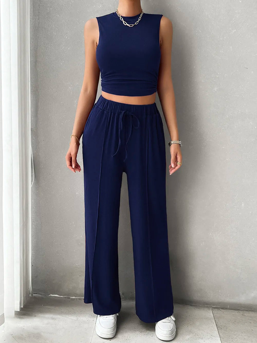 Front view of Devine mock neck sleeveless pants set