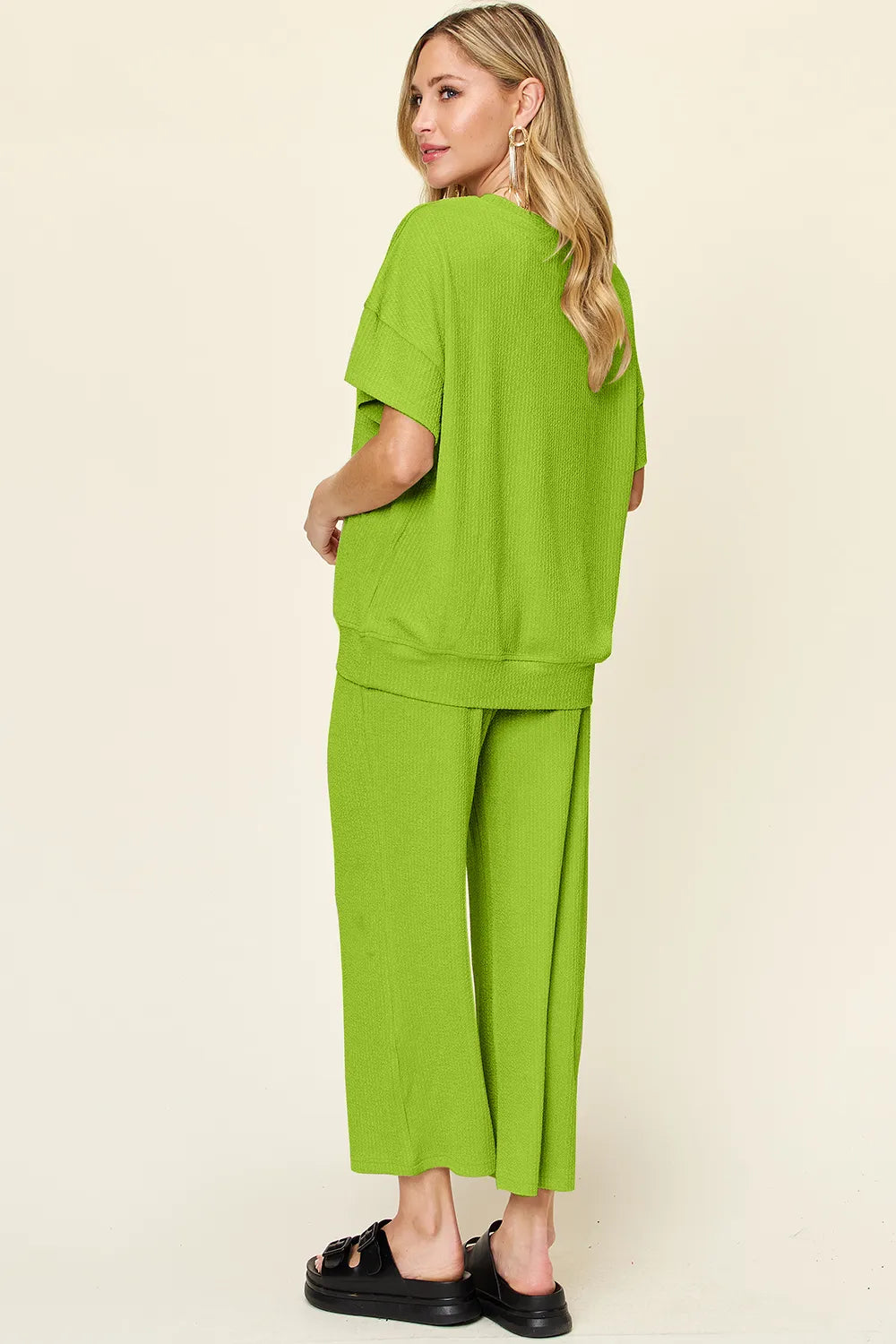 Back view of Double Take textured round neck t-shirt and wide leg pants