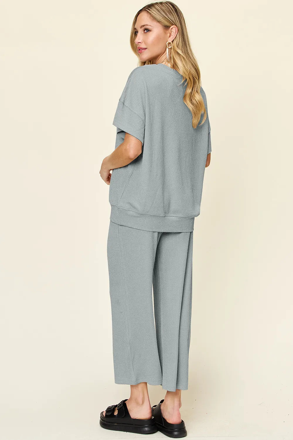Back view of Double Take textured t-shirt and pants