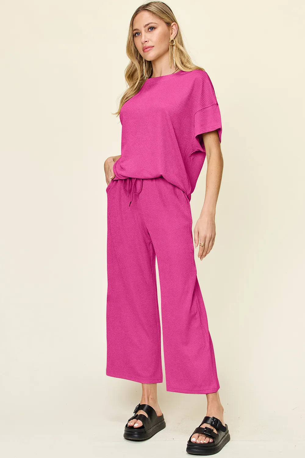 Side angle of Double Take round neck t-shirt and wide leg pants