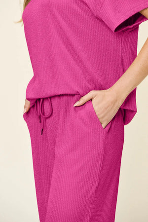 Side view of Double Take textured round neck t-shirt and pants set
