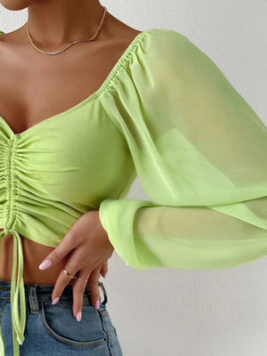 Front view highlighting overall design and drawstring feature