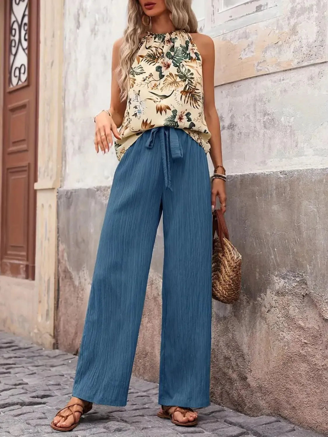 Stylish printed tank top outfit with wide leg pants front view