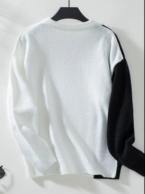 two tone long sleeve sweater on hanger retail display