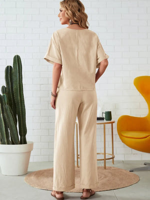 Rear view of round neck half sleeve top and pocketed pants