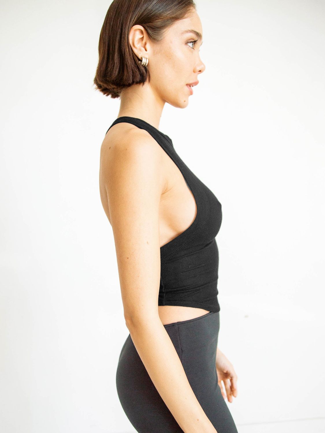 Side angle showing top’s silhouette and fit