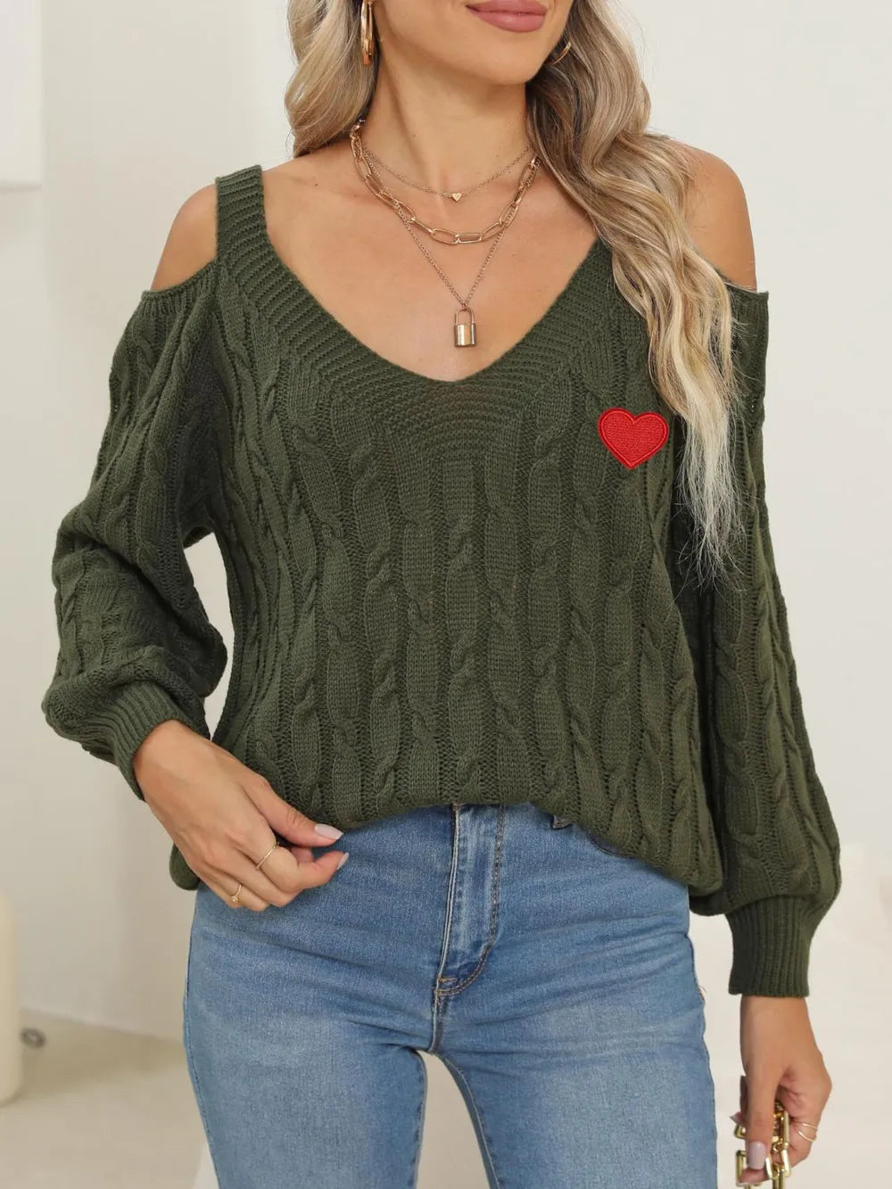 Front view of Cable-Knit Heart V-Neck Sweater with soft cable knit texture