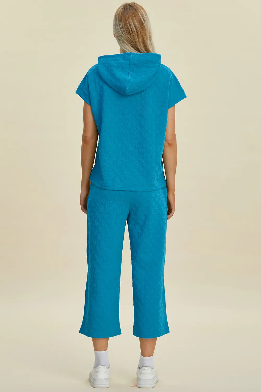 Back view showcasing the clean silhouette and fabric texture