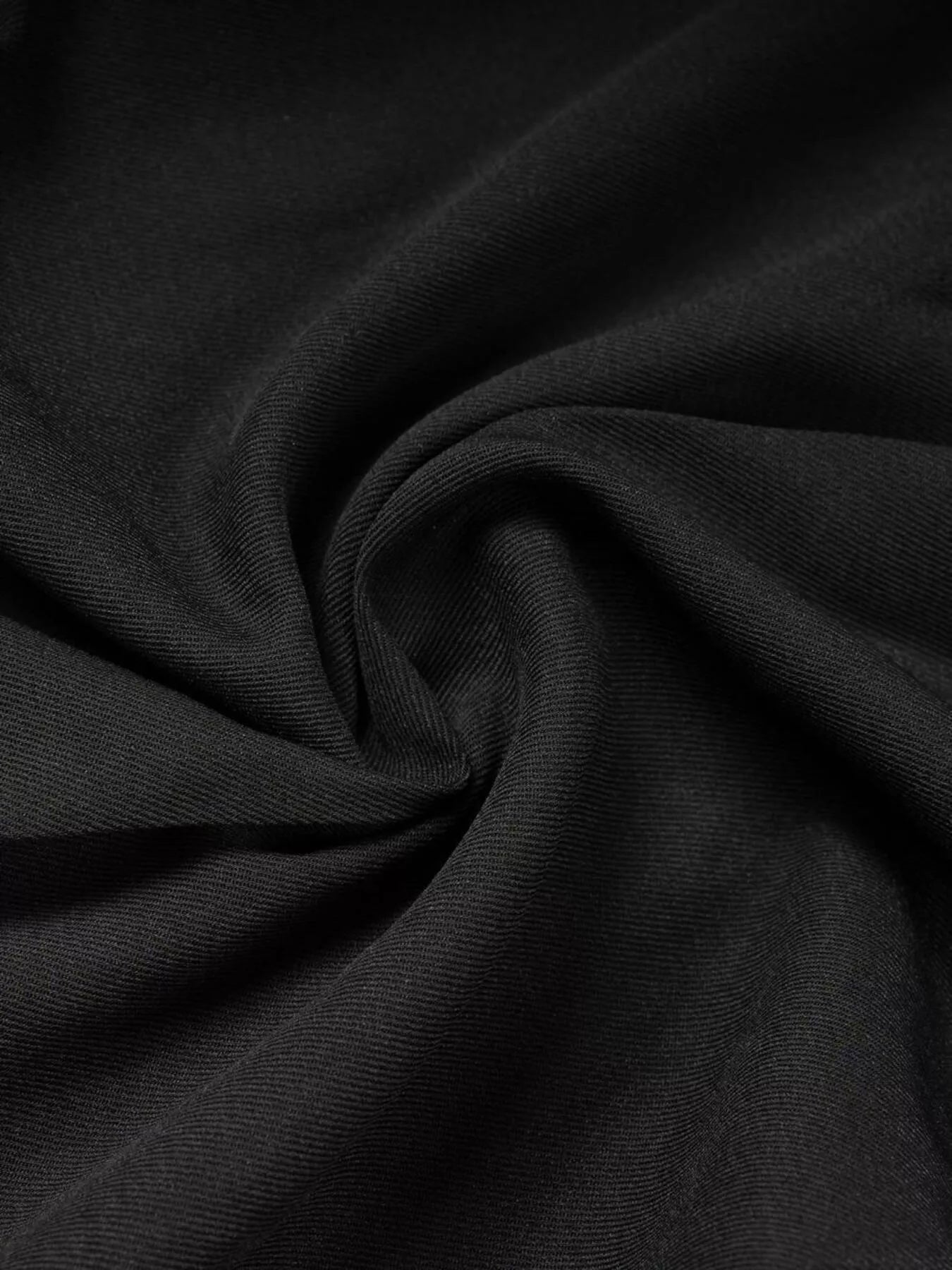 Waist detail of high-waisted wide-leg pants