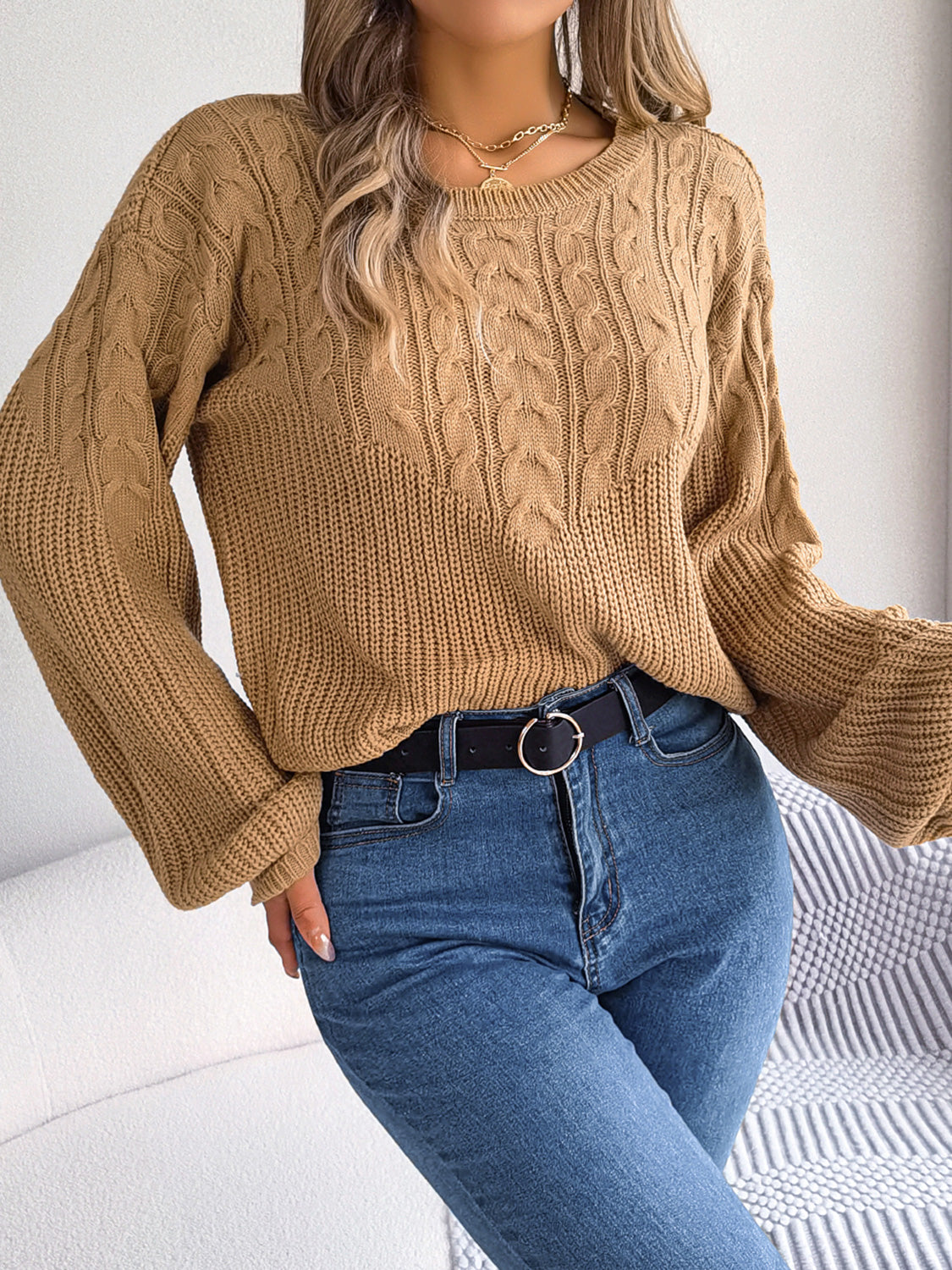 Casual front view of drop shoulder cable knit sweater for everyday wear