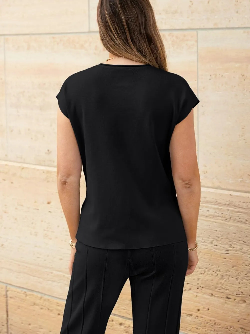 Rear view of round neck cap sleeve knit outfit