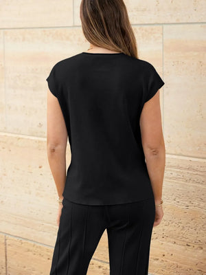 Rear view of round neck cap sleeve knit outfit