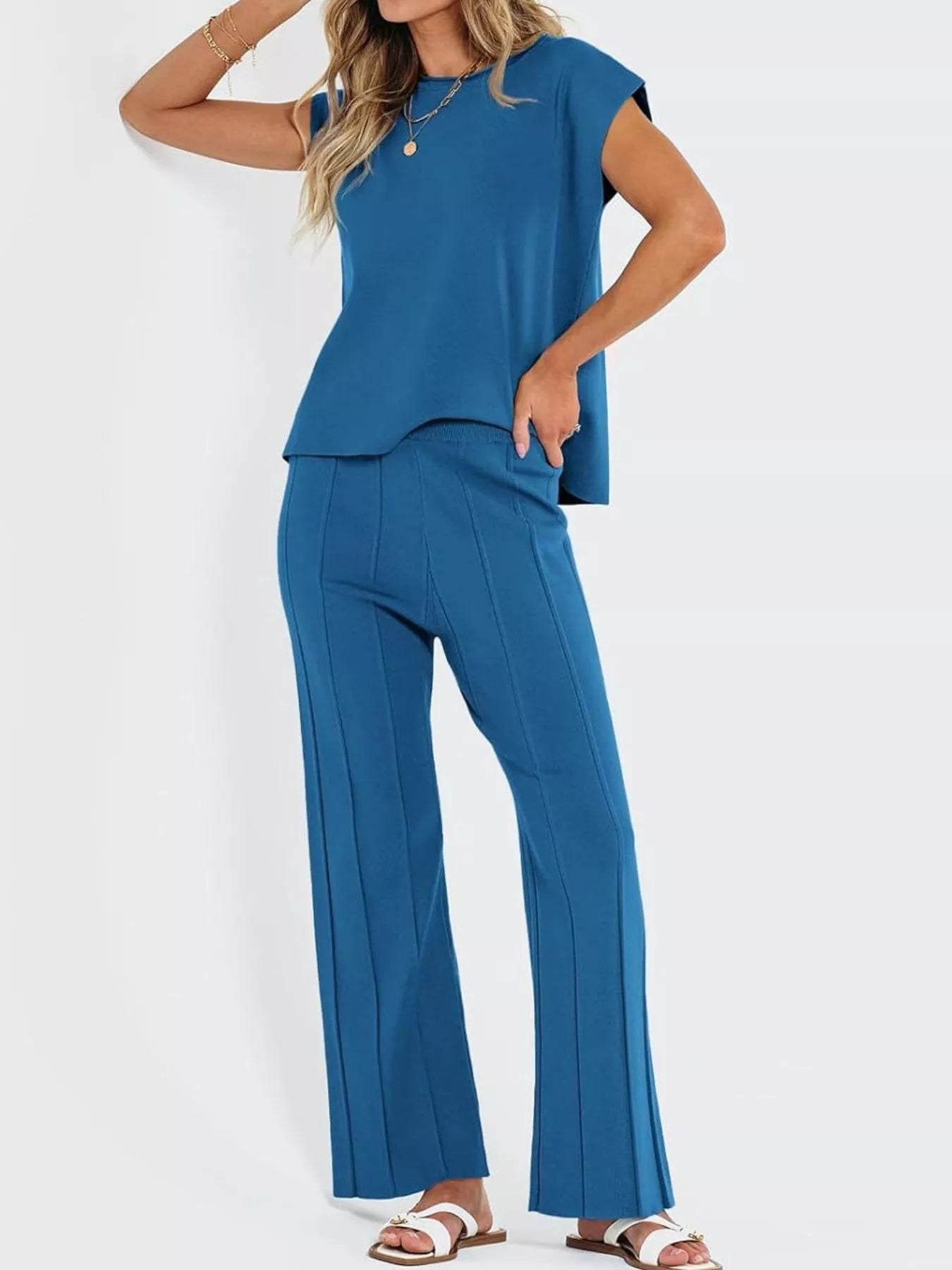 Front view of casual solid color cap sleeve top and pants knit set