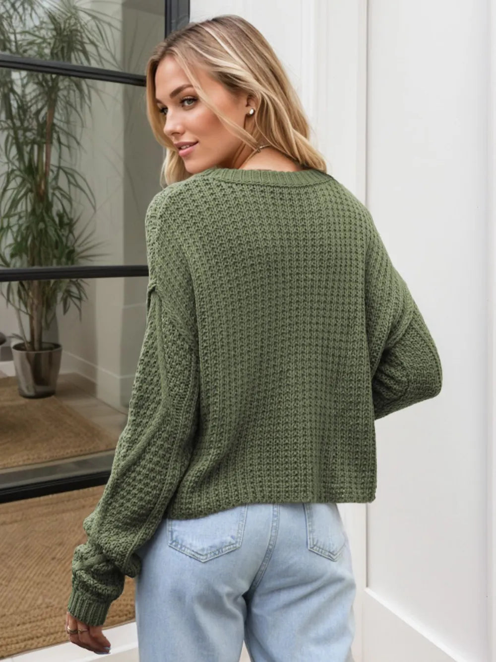 Back view cable knit sweater relaxed shoulder design
