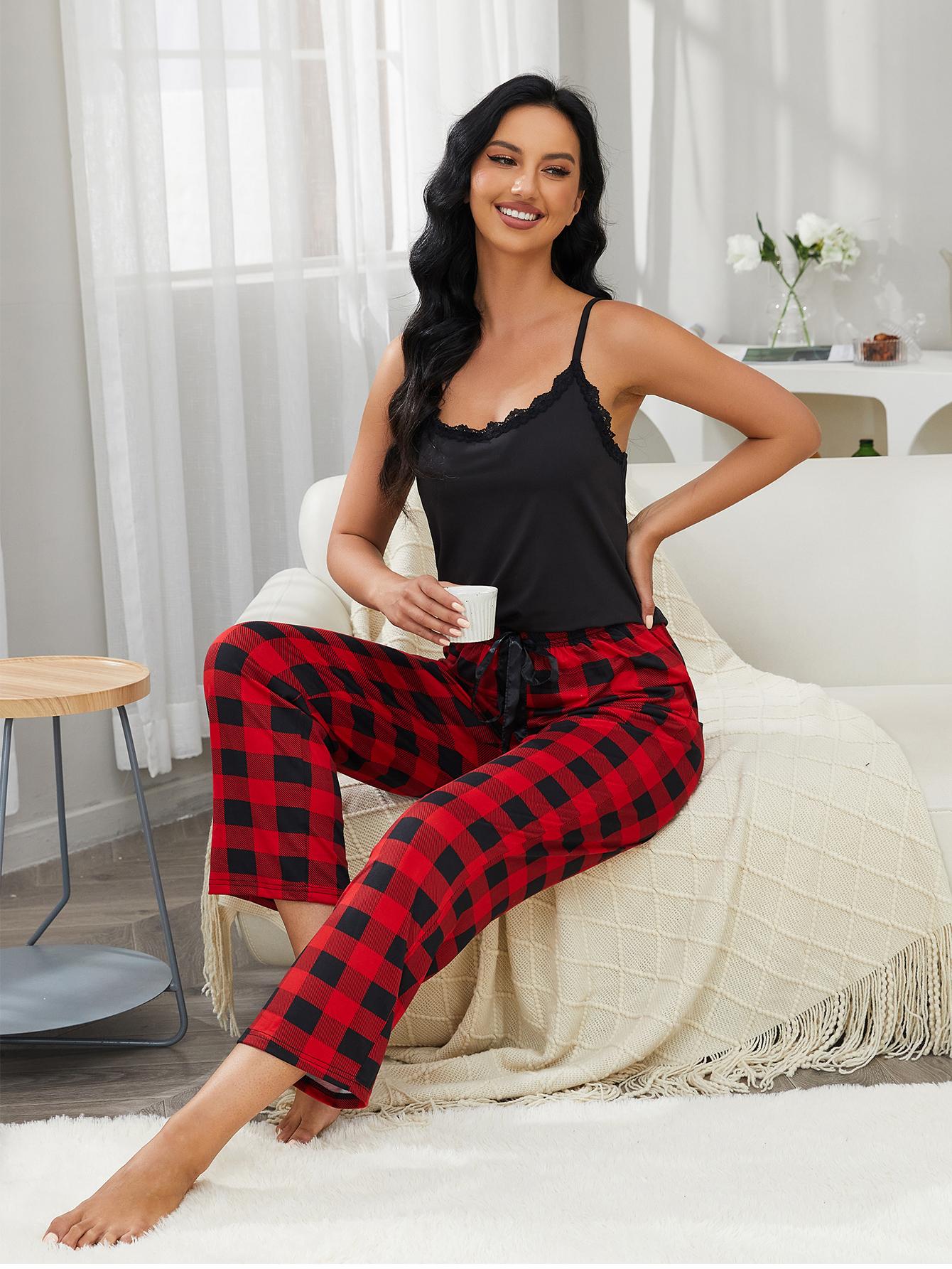 Side angle seated view of lace trim cami and plaid pants set